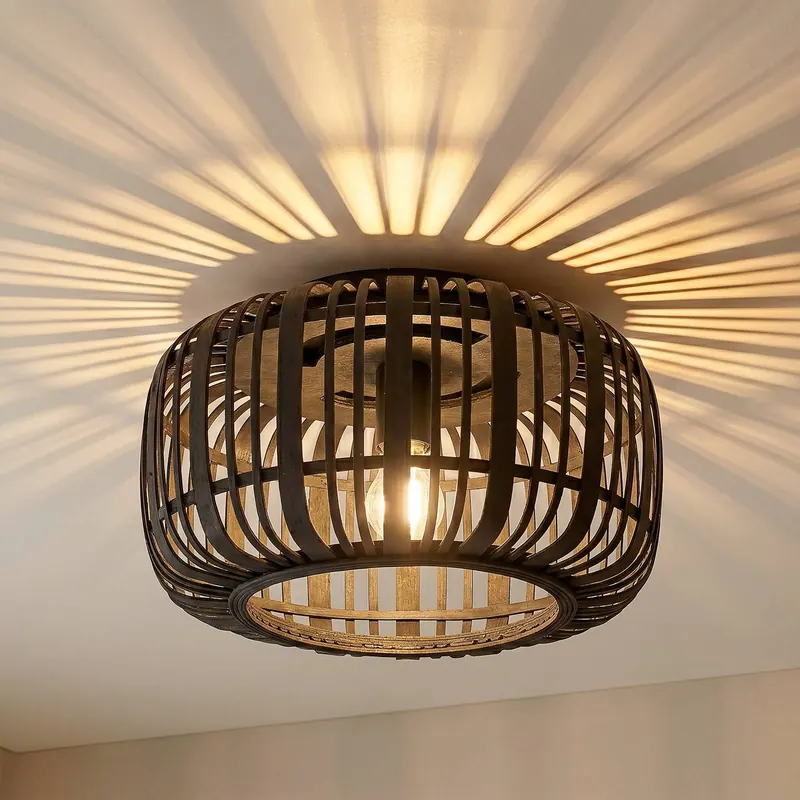 Lampa sufitowa Lindby Canyana, czarna, rattan, Ø 40 cm