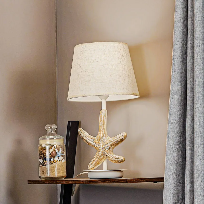 Lampa stołowa Stellina, abażur z tkaniny, dekoracja w kształcie rozgwiazdy
