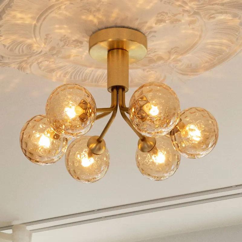 Lampa sufitowa Nuura Apiales 6, Ø 50 cm, kolor mosiężny/złoty
