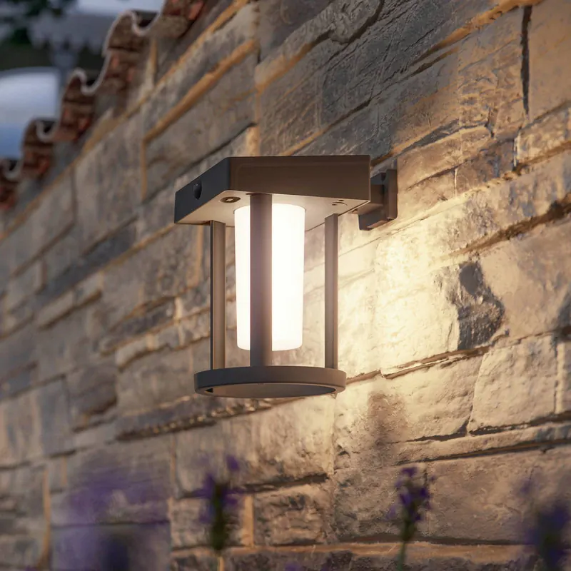 Lampa ścienna z czujnikiem solarnym Philips Camill, czarno-biała, Ø 14 cm