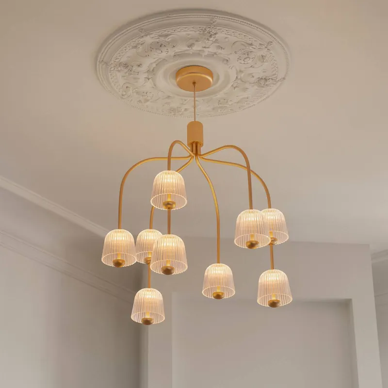 Żyrandol LED Nuura Asteea 9, Ø 66 cm, kolor mosiężny/przezroczysty