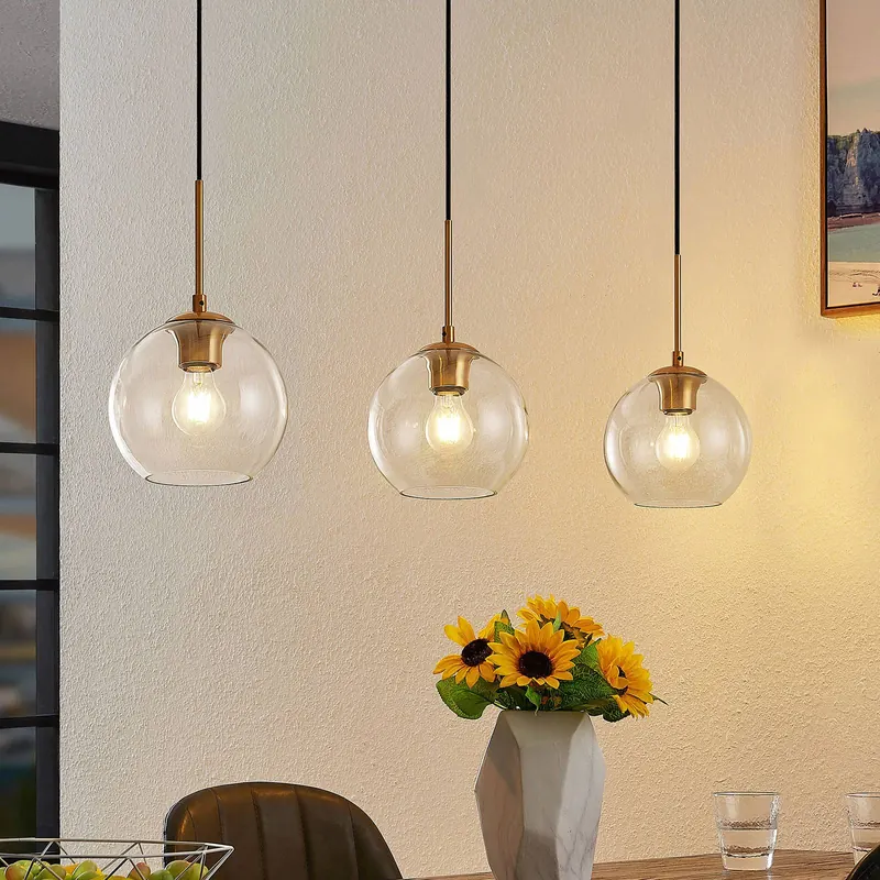 Lampa wisząca Lindby Grady, mosiądz/przezroczysty, 110 cm, metal, szkło