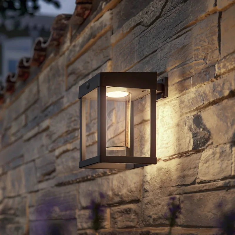 Lampa ścienna z czujnikiem solarnym Philips Camill czarna/przezroczysta 14 x 14